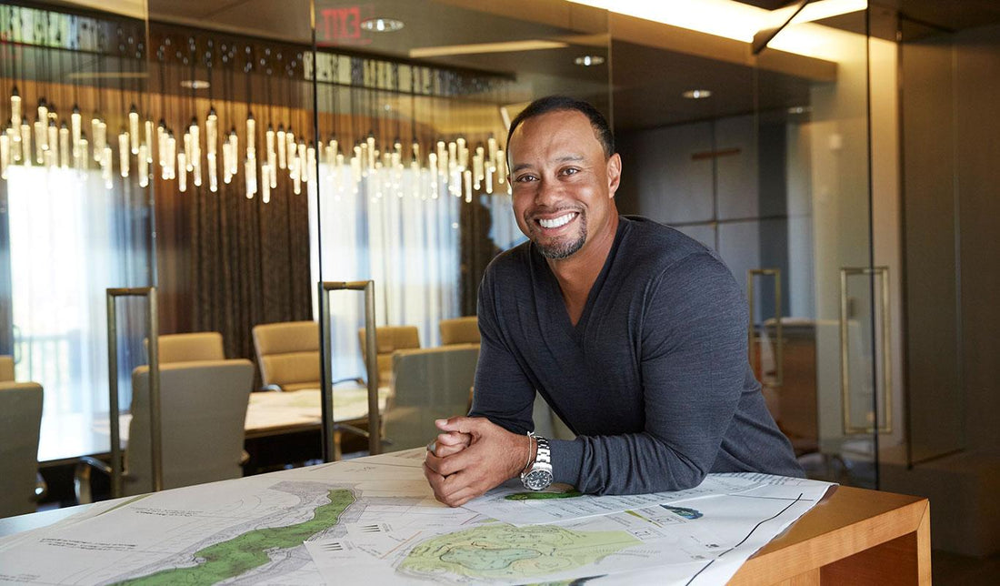 Tiger Woods reviews golf course design plans at a previous TGR Design project