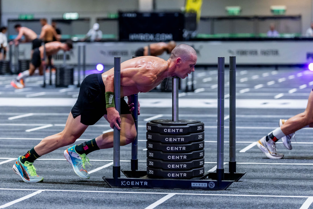 HYROX athletes pacing the running segment of an indoor race