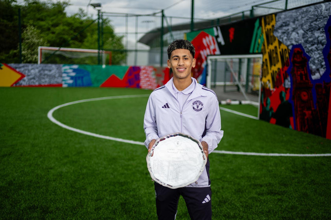 JJ Gabriel holding Manchester United's 2025/26 Jimmy Murphy Young Player of the Year award