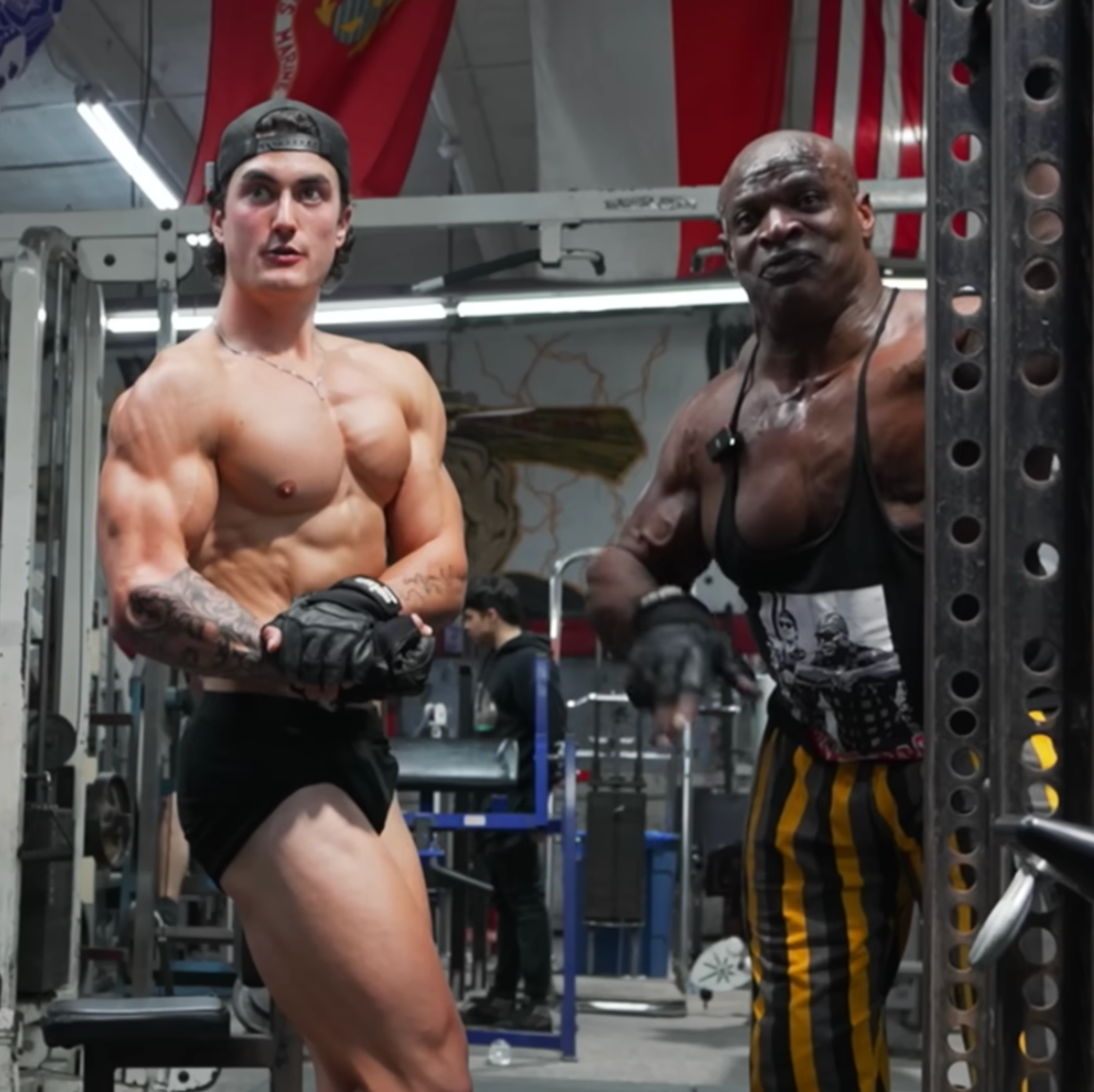 Jesse James West and Ronnie Coleman posing together in a bodybuilding gym