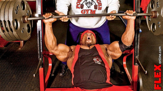 Kai Greene bench pressing during a heavy bodybuilding chest workout
