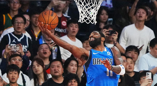 Kyrie Irving finishes a reverse layup for Dallas against Houston in Macao on October 11, 2026