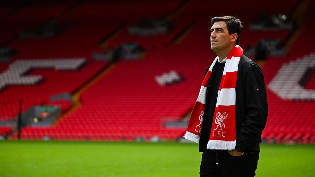Andoni Iraola wearing a Liverpool scarf at Anfield in 2026