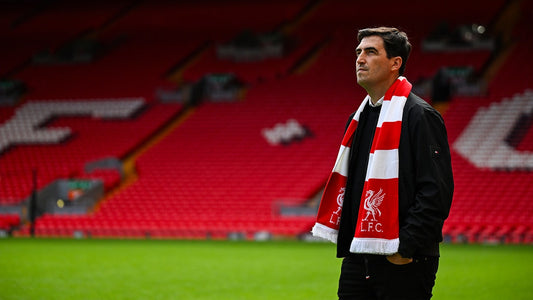 Andoni Iraola wearing a Liverpool scarf at Anfield in 2026