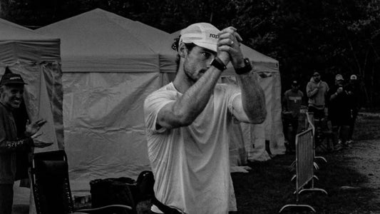 Mark Dowdle applauding in a white shirt and cap after the 2026 Big's Backyard Ultra