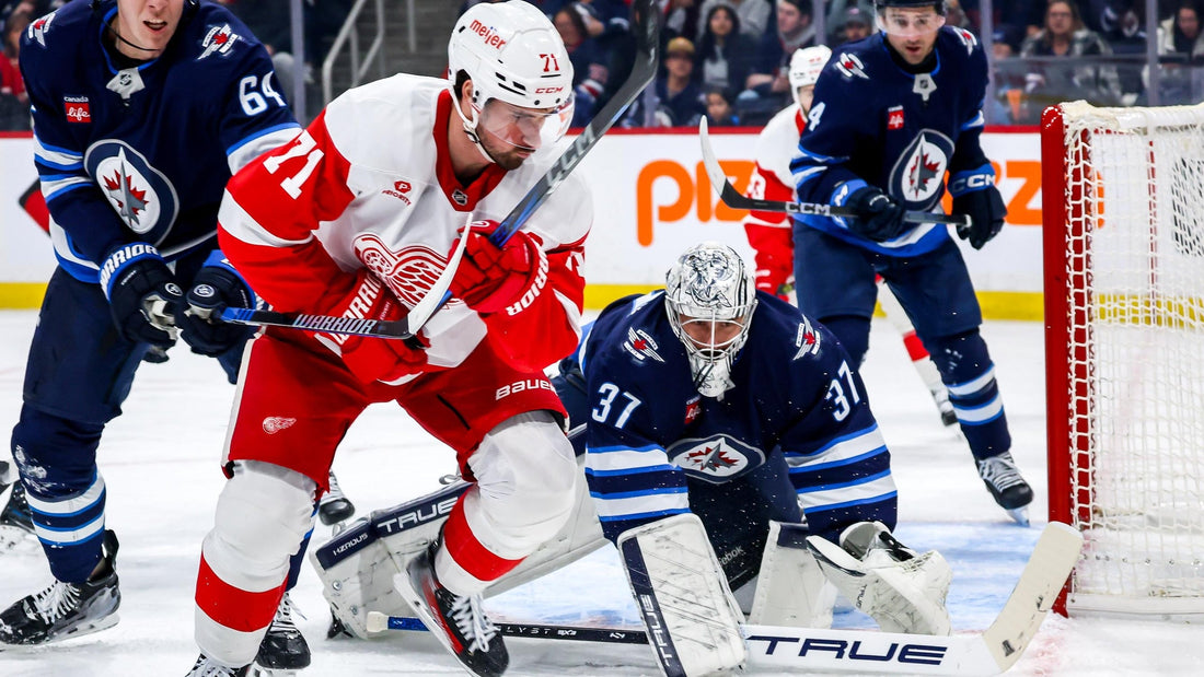 Dylan Larkin and Connor Hellebuyck during the 2026 NHL season