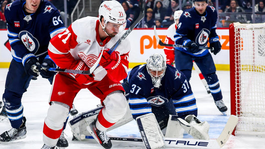Dylan Larkin and Connor Hellebuyck during the 2026 NHL season