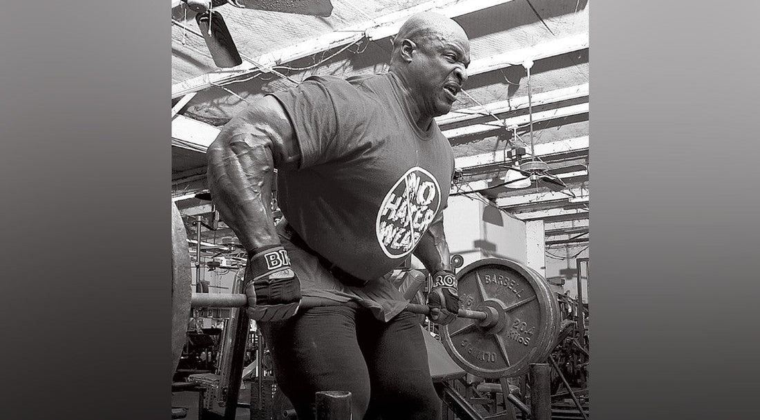 Ronnie Coleman pressing enormous dumbbells during a heavy chest workout