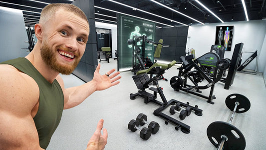 Jeff Nippard standing in his high-tech Muscle Lab gym, presenting its training equipment
