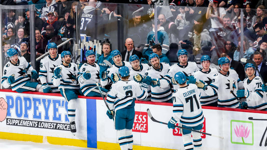 Will Smith celebrates with San Jose Sharks teammates during the 2026 NHL season