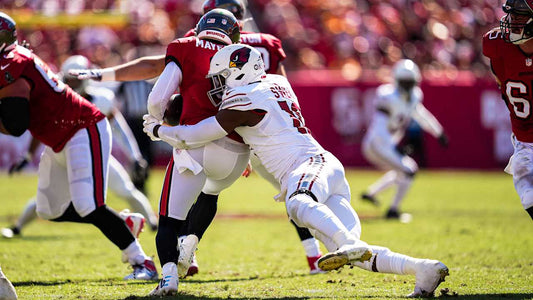 Arizona Cardinals linebacker Josh Sweat sacks Baker Mayfield during a 2025 game