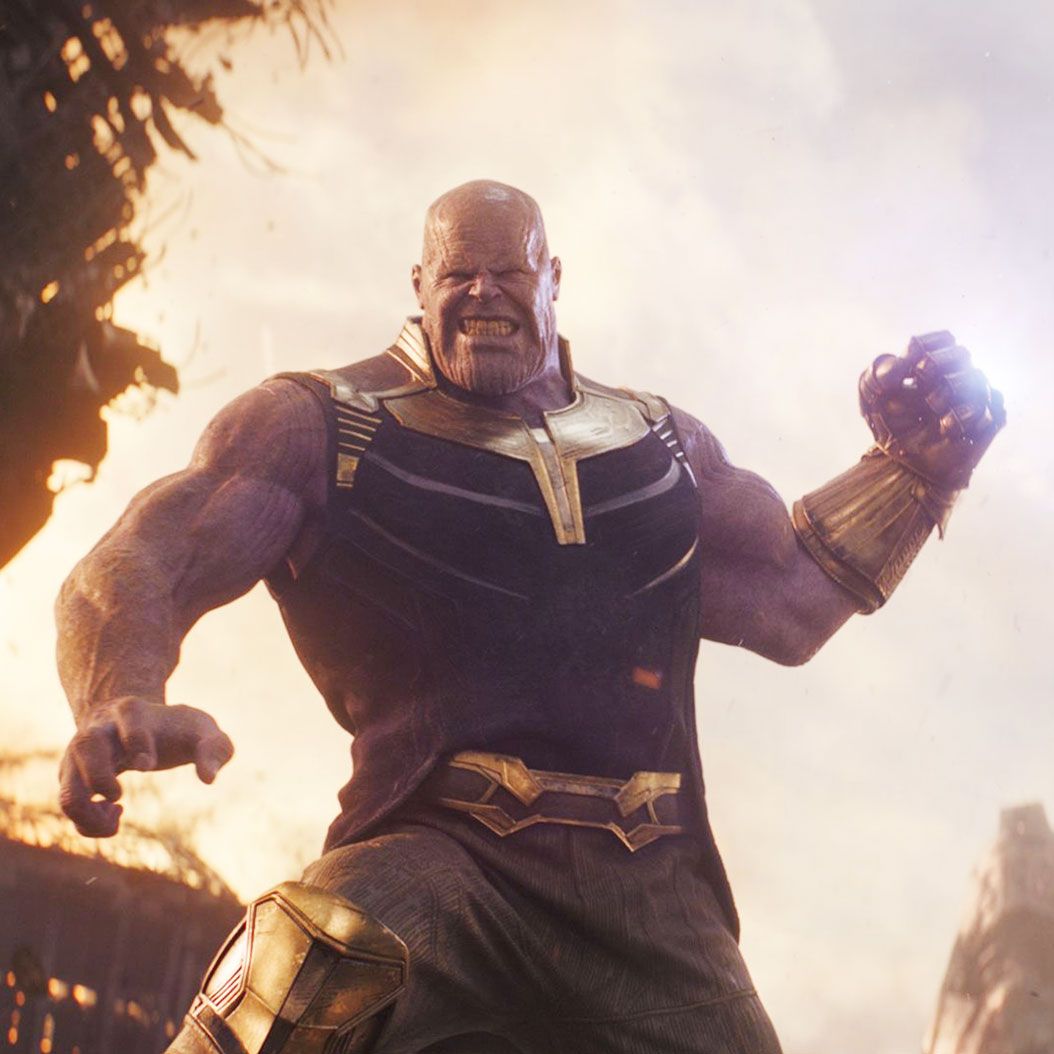 Thanos, the muscular Mad Titan, standing with his Infinity Gauntlet amid a battlefield
