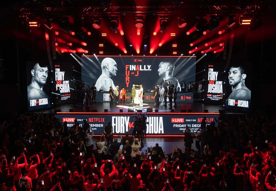 Tyson Fury and Anthony Joshua face off on the wide Netflix press-conference stage in London in September 2026