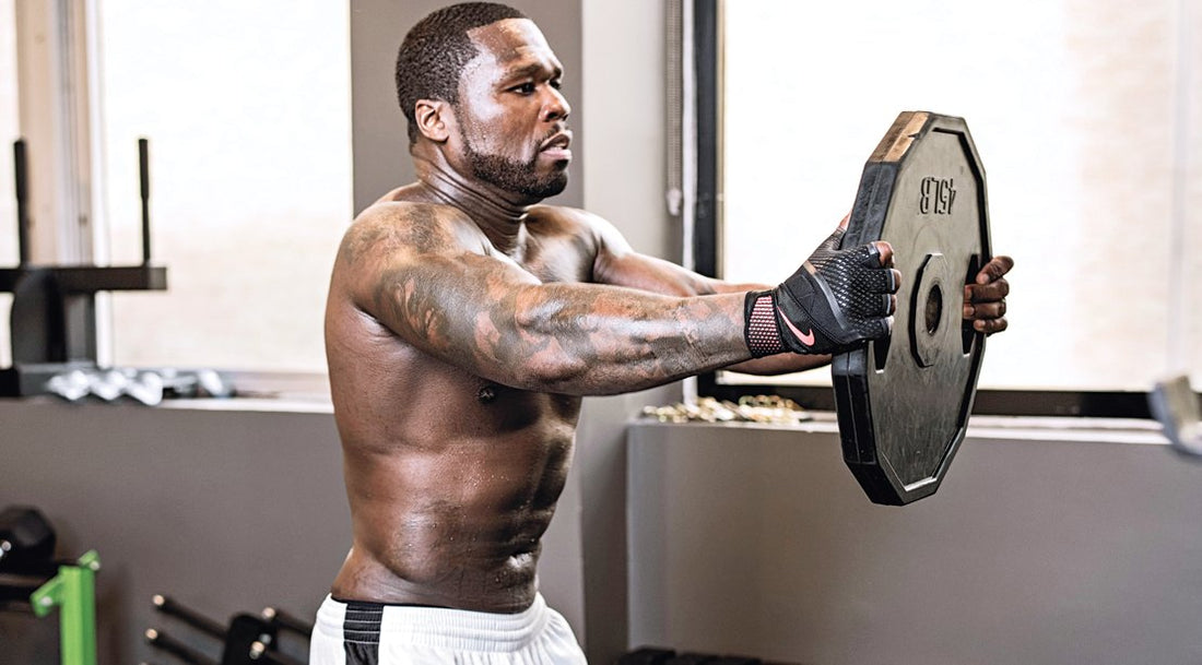 50 Cent training in the gym with a muscular upper body