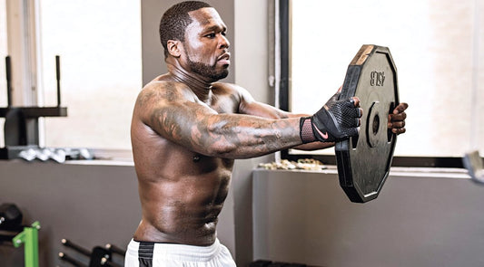 50 Cent training in the gym with a muscular upper body