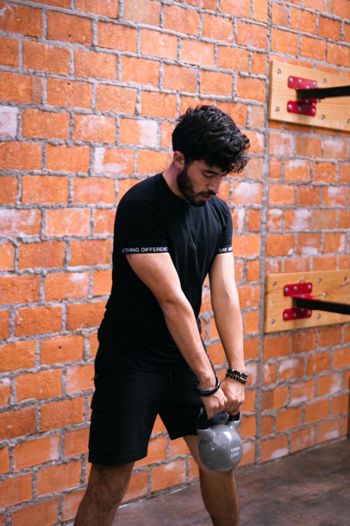 Athlete training with a kettlebell in a gym