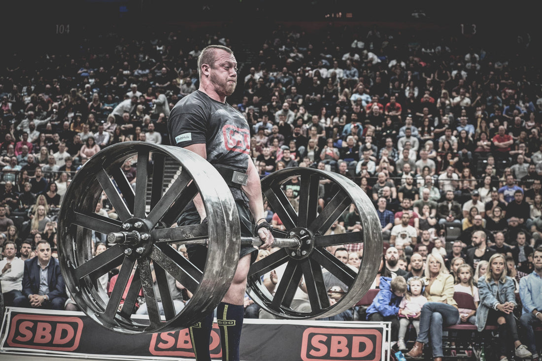 Adam Bishop competing on a wheel deadlift at Giants Live