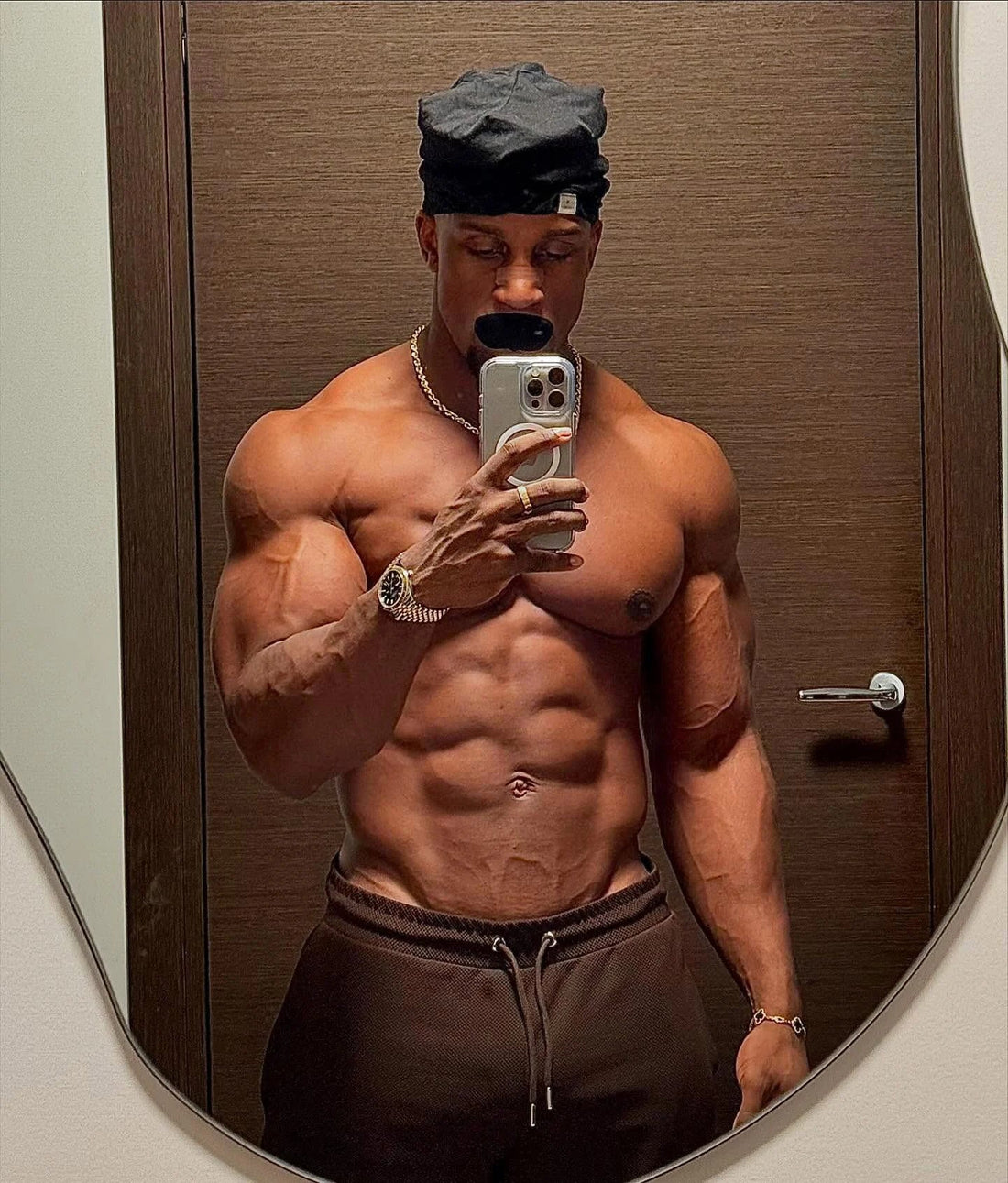 Ashton Hall posing shirtless in a mirror selfie
