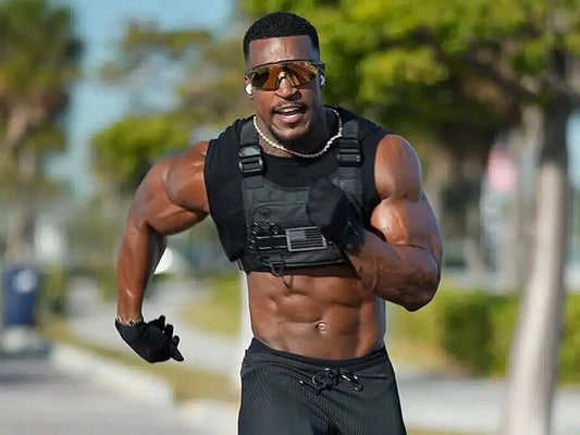Ashton Hall showing his lean muscular physique