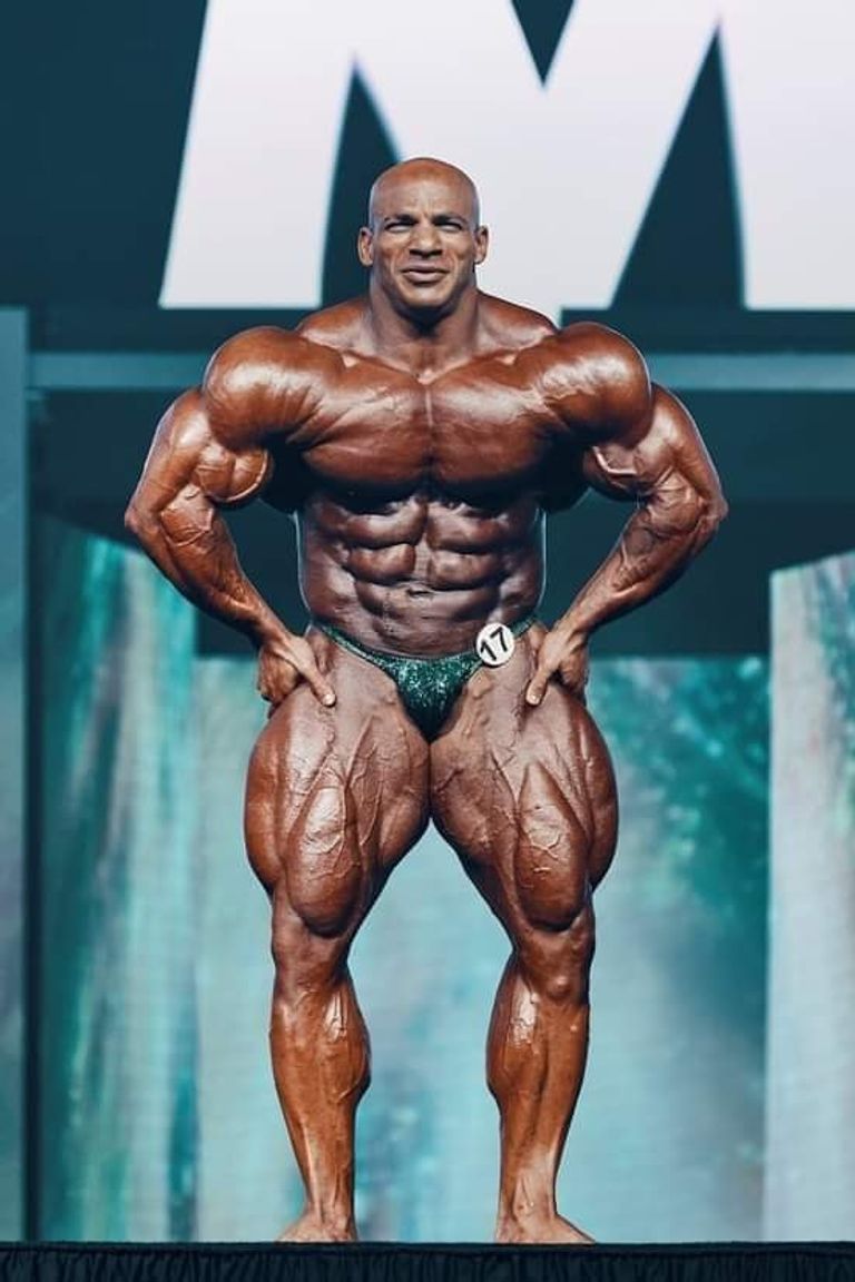 Big Ramy posing onstage, representing the mass-monster era of bodybuilding