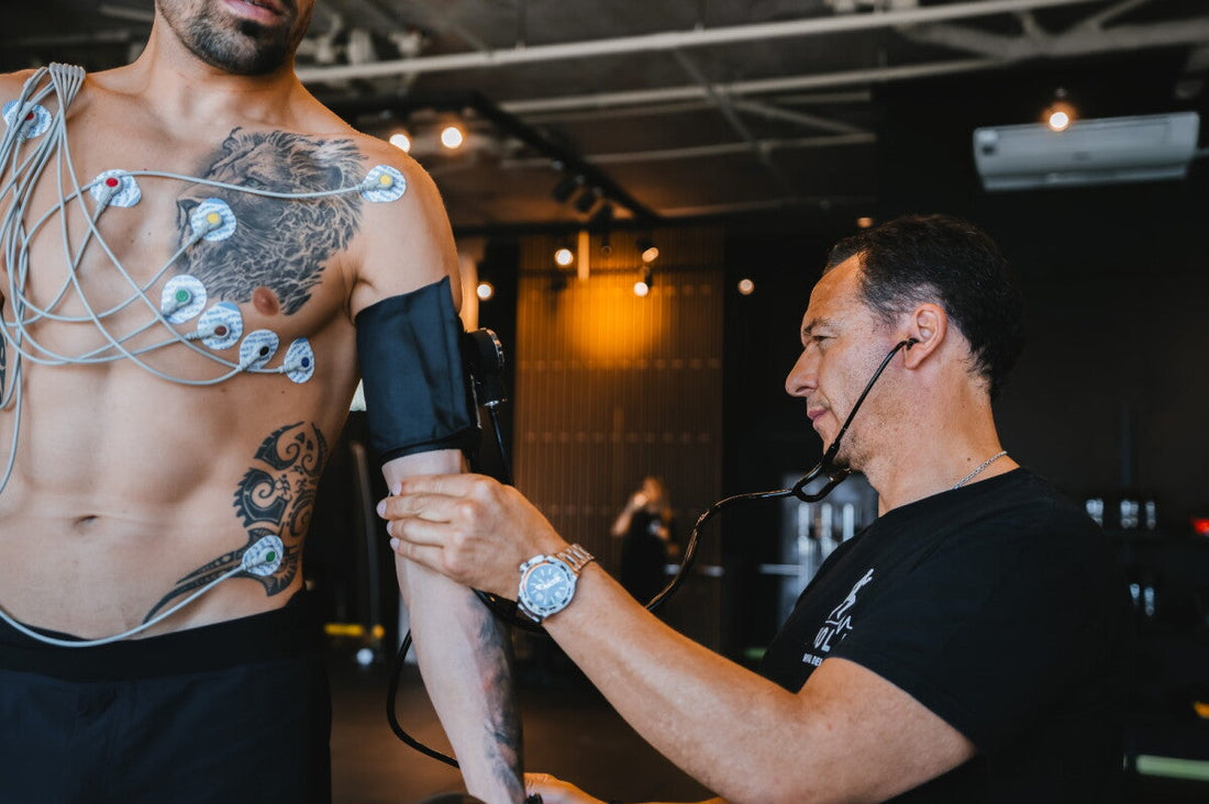 Muscular athlete receiving a cardiovascular health assessment