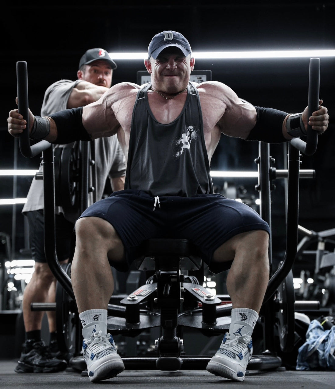 Bodybuilder pressing on a plate-loaded machine