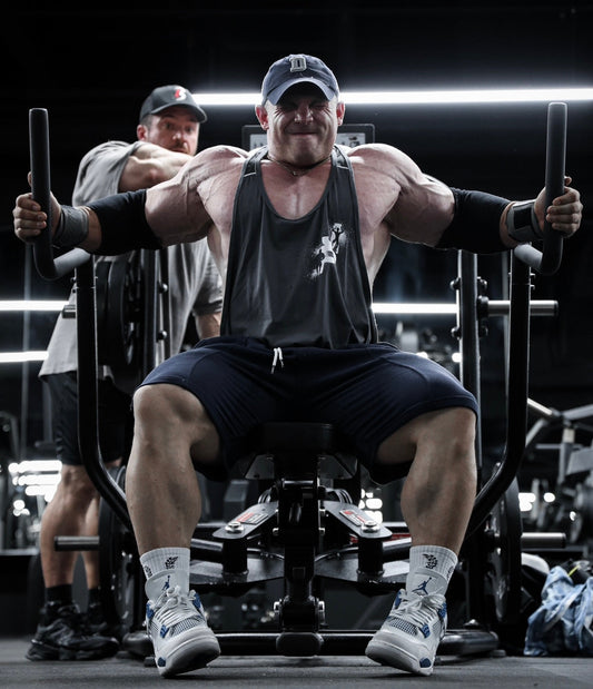 Bodybuilder pressing on a plate-loaded machine