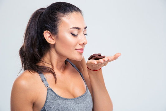 Athlete smelling chocolate before a workout