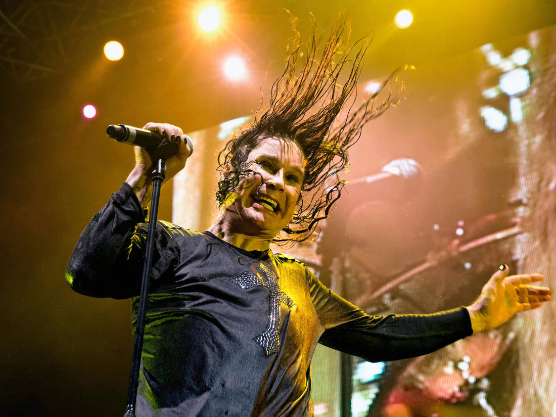 Ozzy Osbourne performing live with high energy on stage