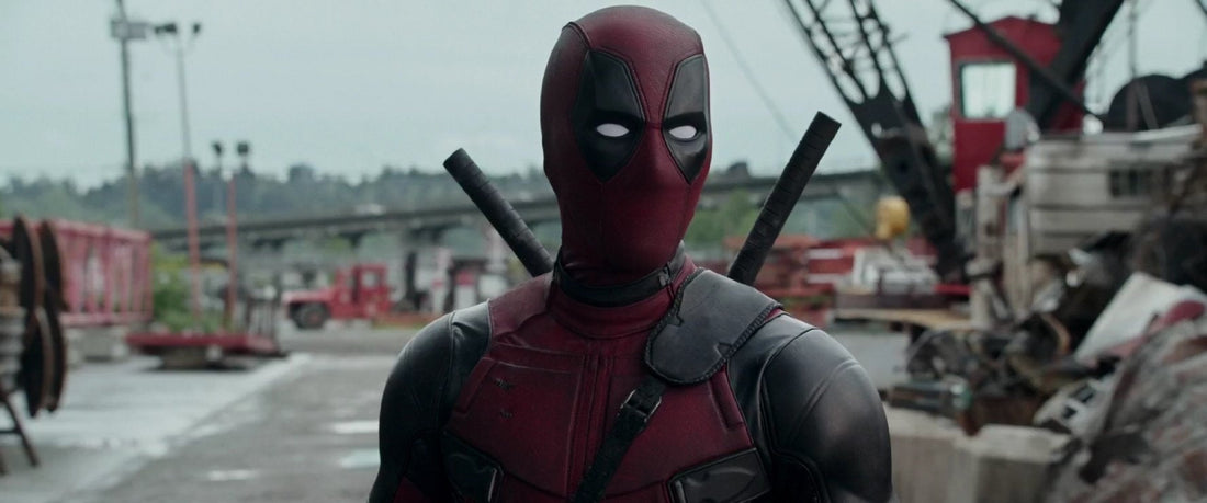 Deadpool in his red-and-black suit in a cinematic action scene