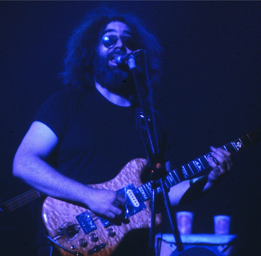 Jerry Garcia performing live with the Grateful Dead during a gym album ranking