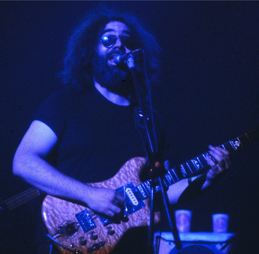Jerry Garcia performing live with the Grateful Dead during a gym album ranking
