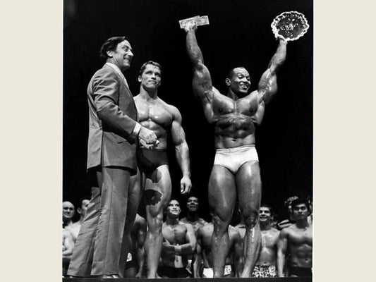 Sergio Oliva and Arnold Schwarzenegger on a classic bodybuilding stage