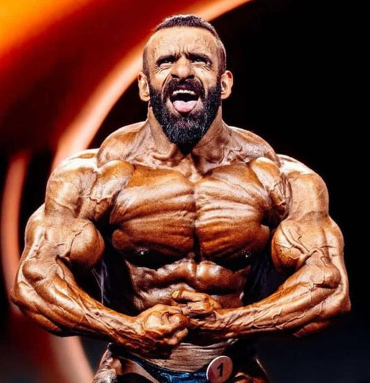 Hadi Choopan posing on the 2025 Mr. Olympia stage
