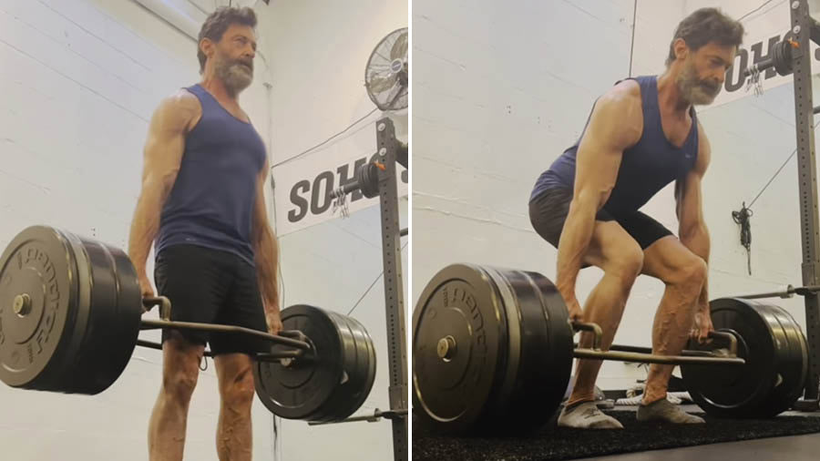 Hugh Jackman performing a heavy trap-bar deadlift in the gym
