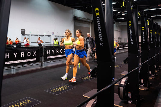 HYROX doubles partners running together through the competition arena