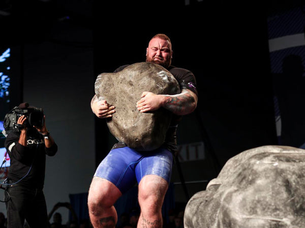 Hafthor Bjornsson carrying the original Husafell Stone in Iceland