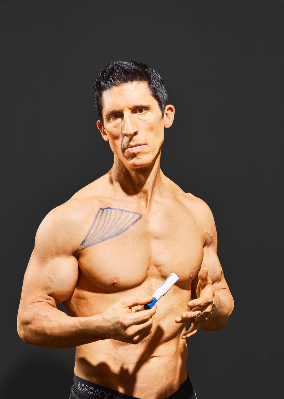 Jeff Cavaliere demonstrating strength training in a gym