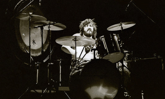 John Bonham performing behind his drum kit during a Led Zeppelin concert