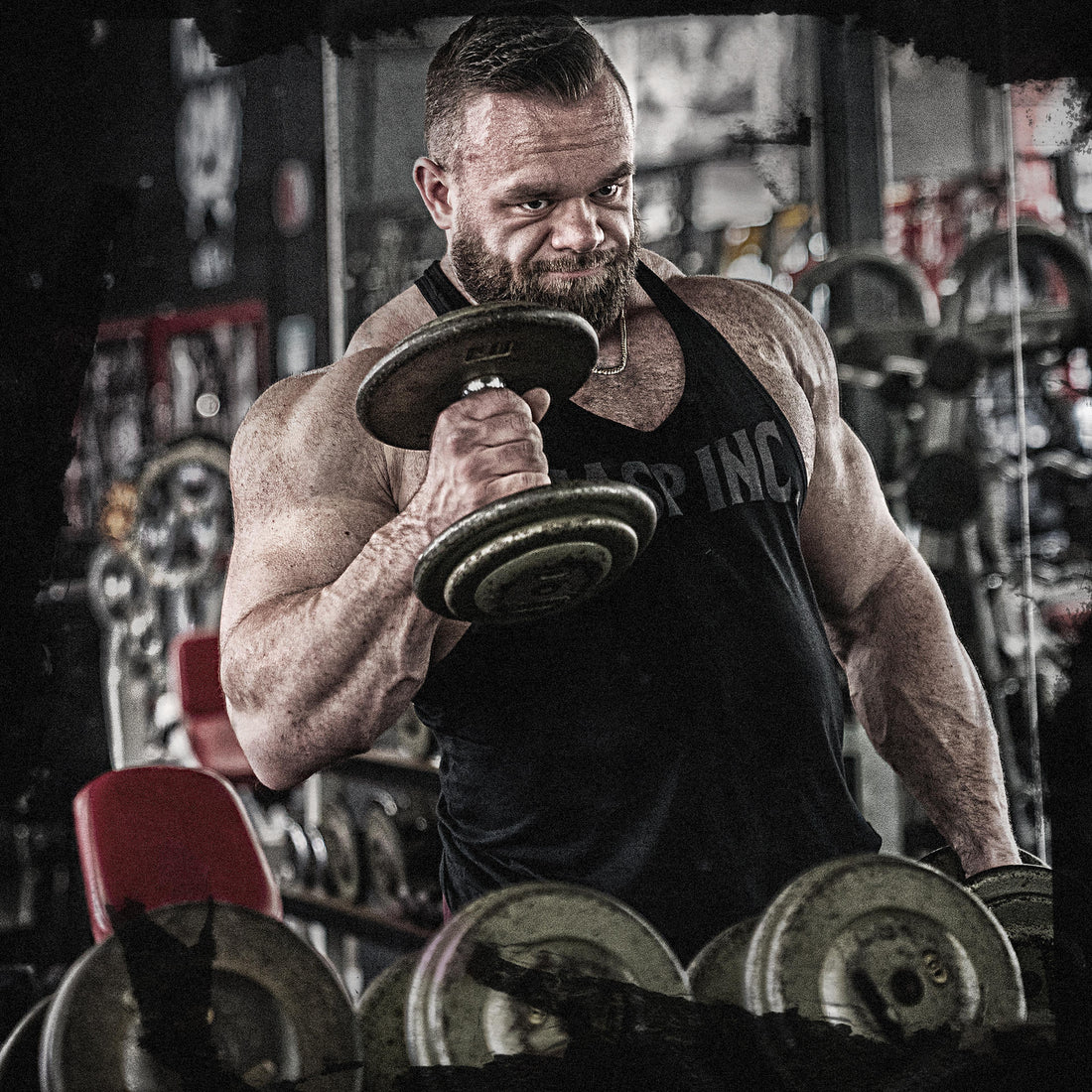 Jordan Hutchinson training with a dumbbell in the gym