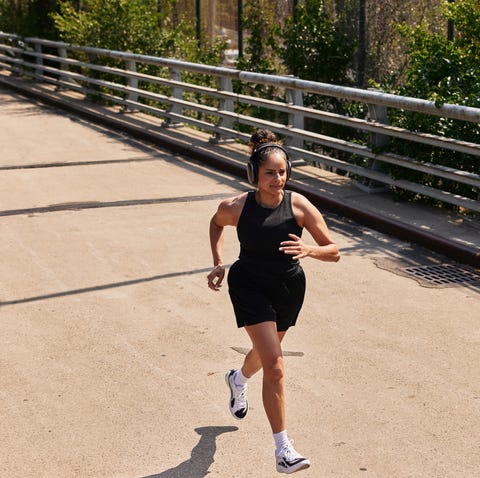 Runner wearing headphones during an outdoor workout