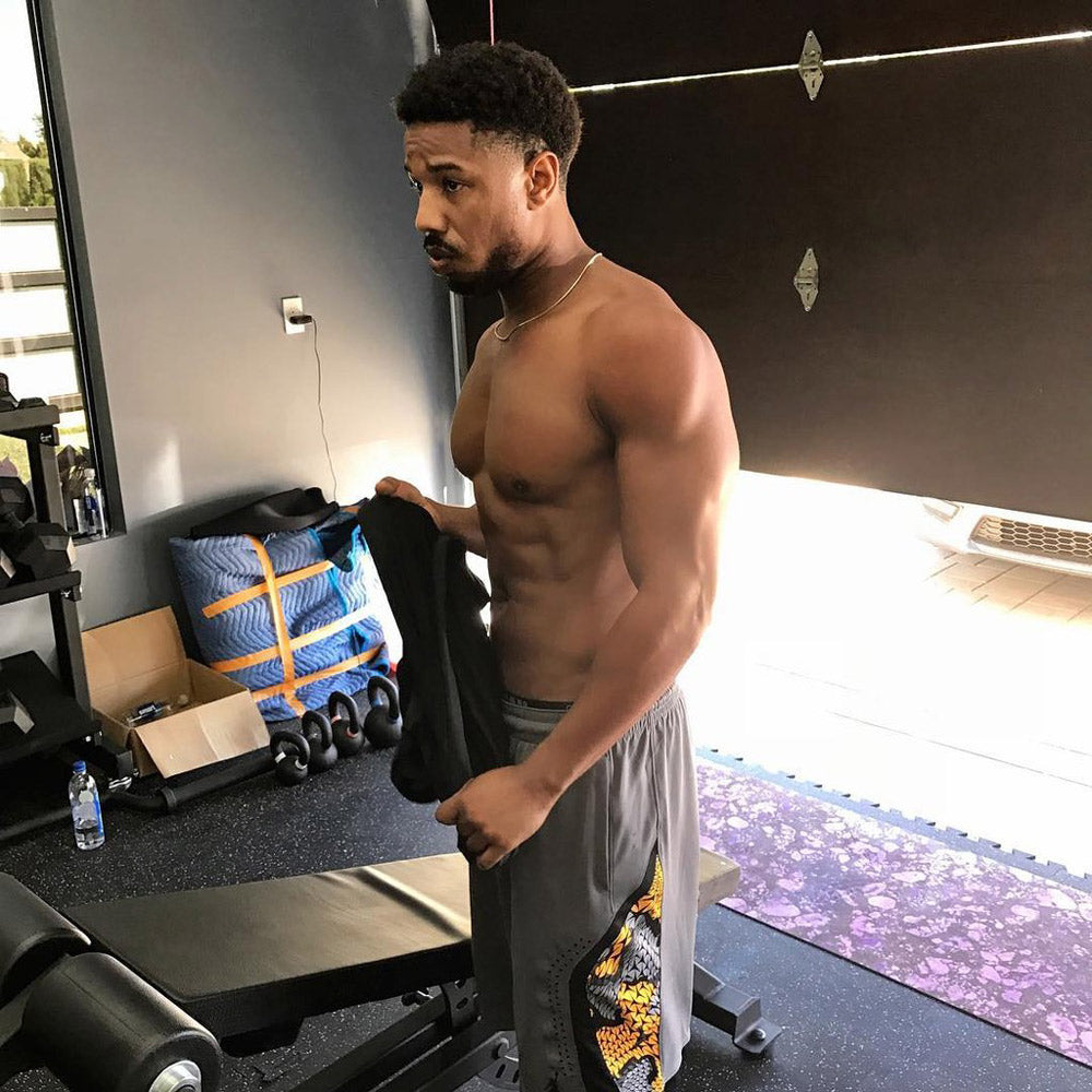 Michael B. Jordan as Killmonger displaying a muscular, athletic physique