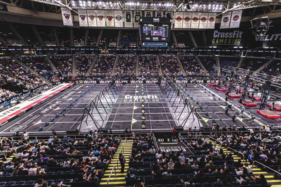 Functional fitness competition floor with athletes, rigs and lanes