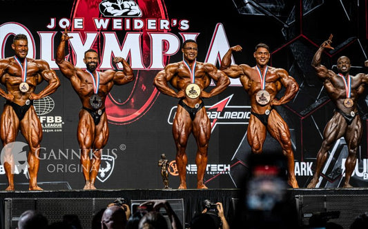 Niall Darwen posing after winning the 2026 Classic Physique Olympia title