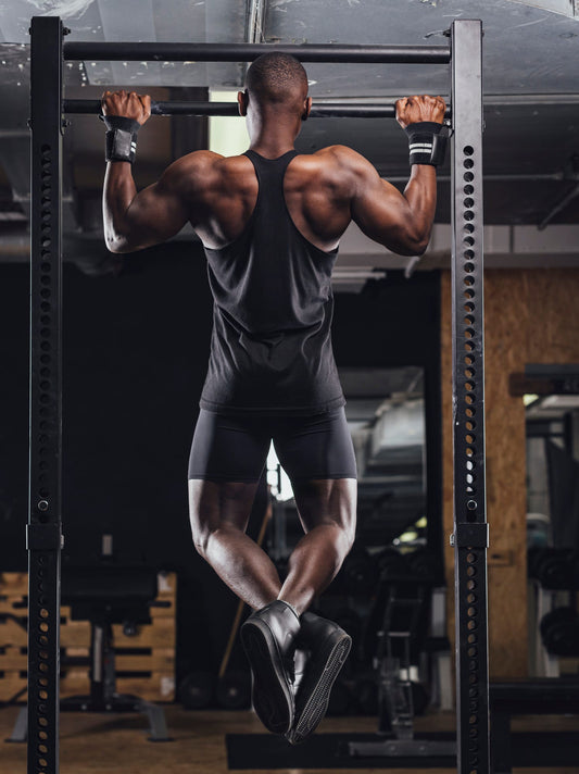 Calisthenics athlete performing a strict pull-up while training for a high-rep set