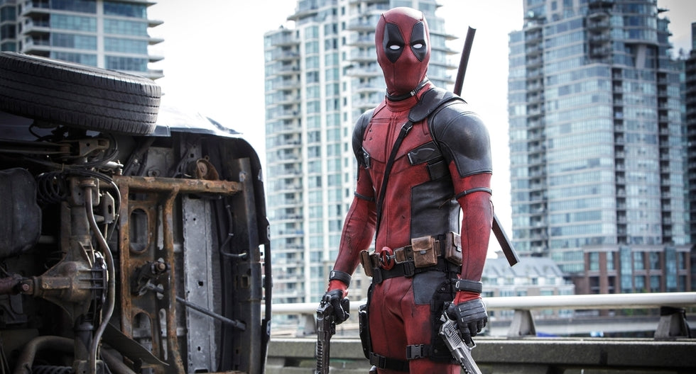 Deadpool in a red-and-black tactical suit showing a lean, broad-shouldered athletic silhouette