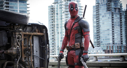 Deadpool in a red-and-black tactical suit showing a lean, broad-shouldered athletic silhouette