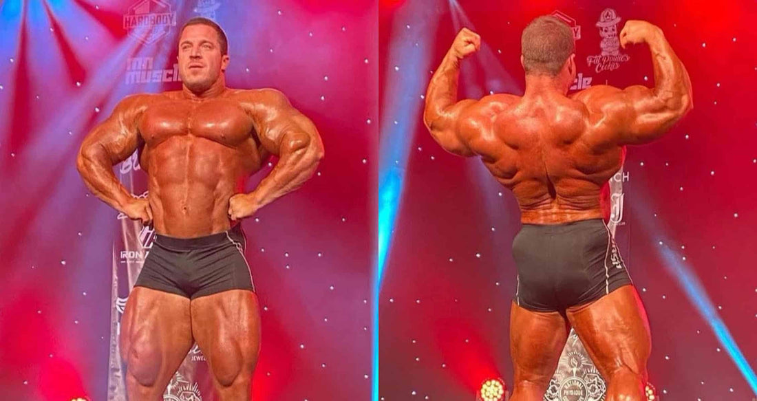 Brett Wilkin posing front and back on a bodybuilding competition stage