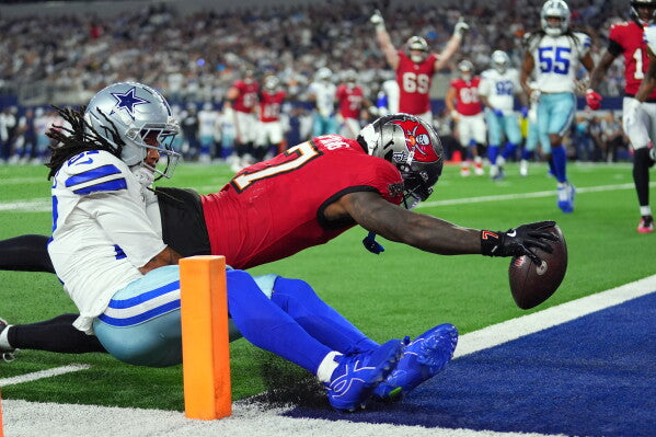 Buccaneers running back Bucky Irving dives into the end zone against Dallas on October 8, 2026
