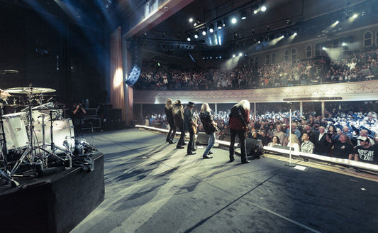 Lynyrd Skynyrd live onstage in the 1970s, capturing the Southern-rock attitude behind the pump-cover look
